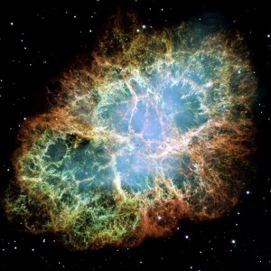The Crab Nebula is actually a remnant of a supernova and contains a pulsating star in its center. A supernova is actually an exploding star. What makes this particular nebula so interesting is that it was observed and recorded by Chinese astronomers as early as 1045 AD. Source: http://hauntinglybeautifulhubbleimages.blogspot.com/